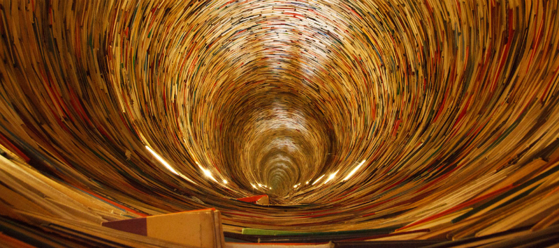 Image of books arranged to form a tunnel, from a library in Prague